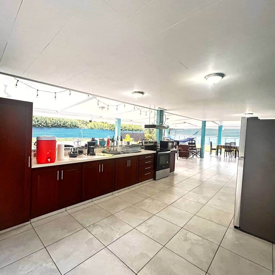Fully equipped kitchen surrounded by a covered terrace