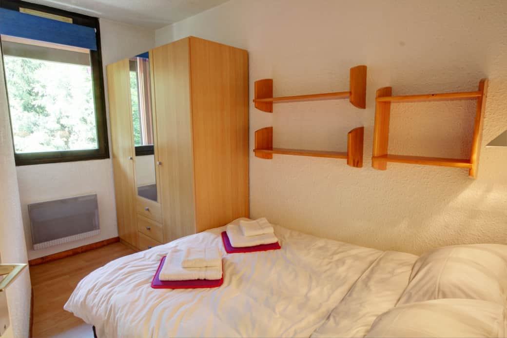 Double bed and a 3-door wardrobe in the bedroom Double bed and a 3-door wardrobe in the bedroom