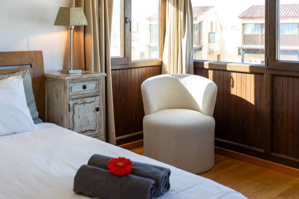 Cozy retreat with panoramic views in the master bedroom