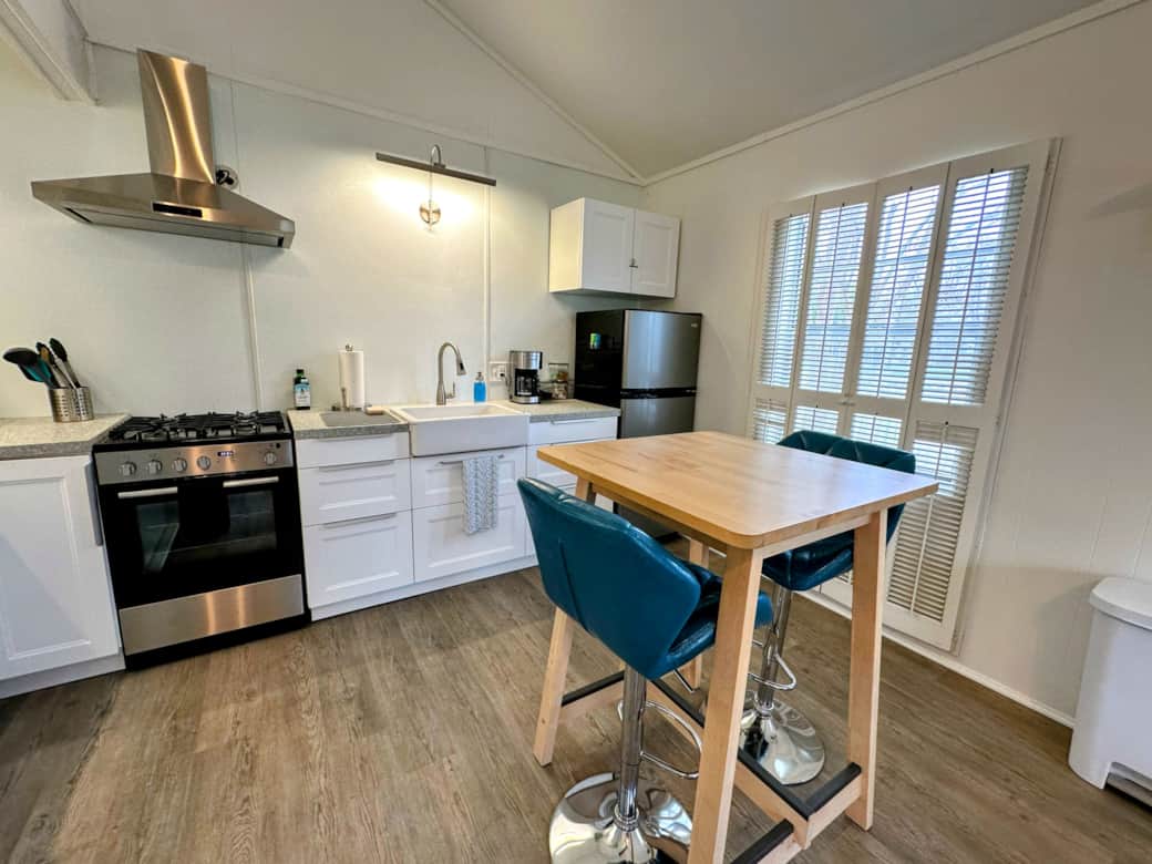 Fully equipped eat-in kitchen with gas stove, farmer's sink, and fridge/freezer. Fully equipped eat-in kitchen with gas stove, farmer's sink, and fridge/freezer.