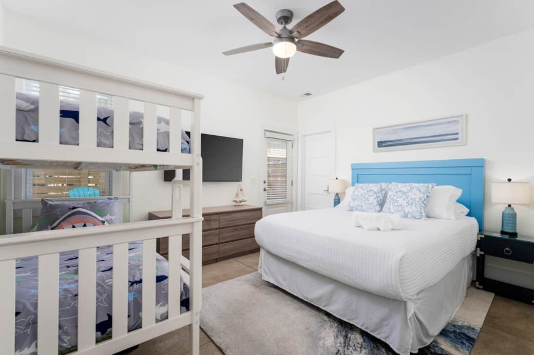 First-floor private suite with queen bed, bunk beds, Smart TV, and full bath—perfect for guests who prefer fewer stairs.