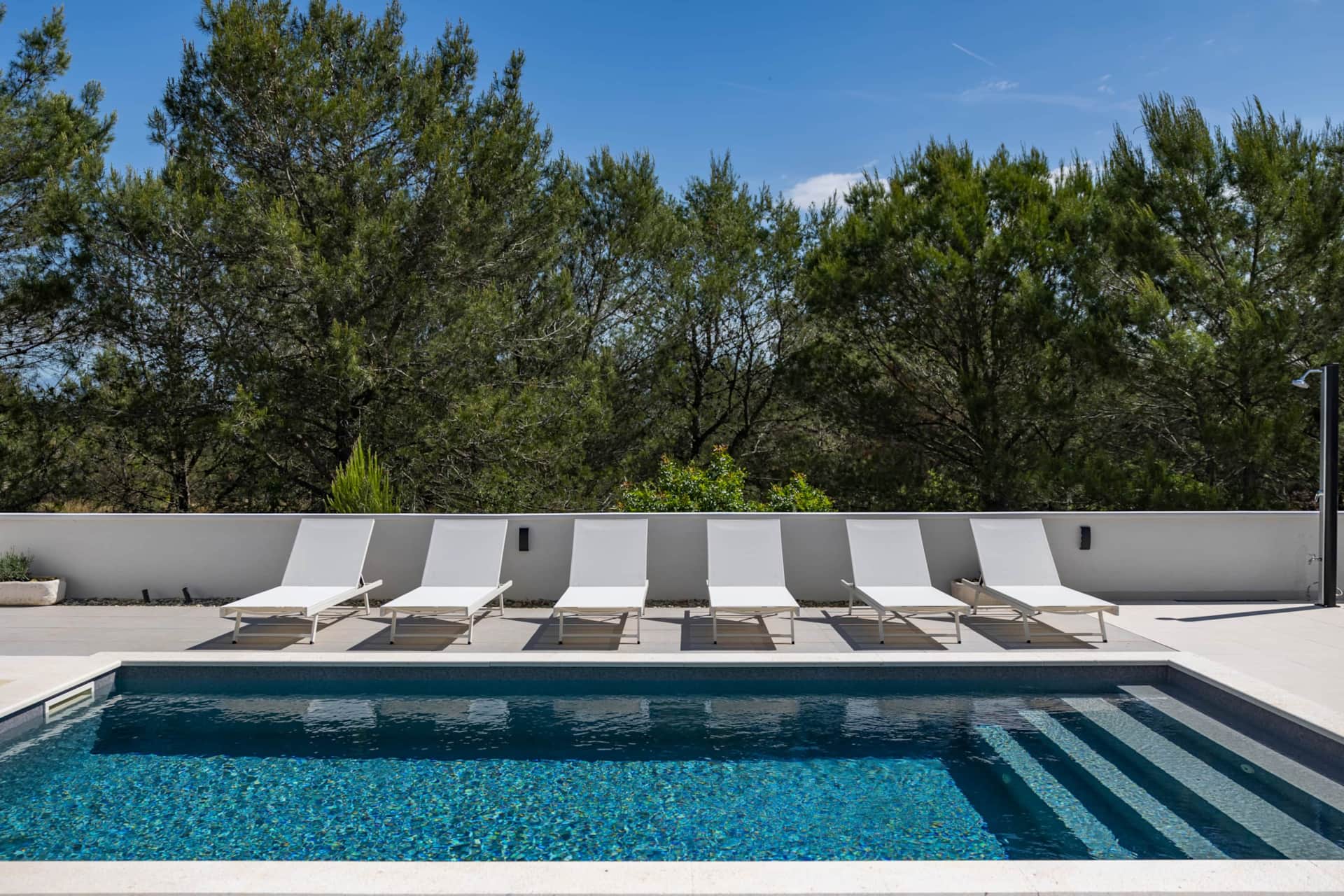 Private pool with sun loungers at Alba Family Home