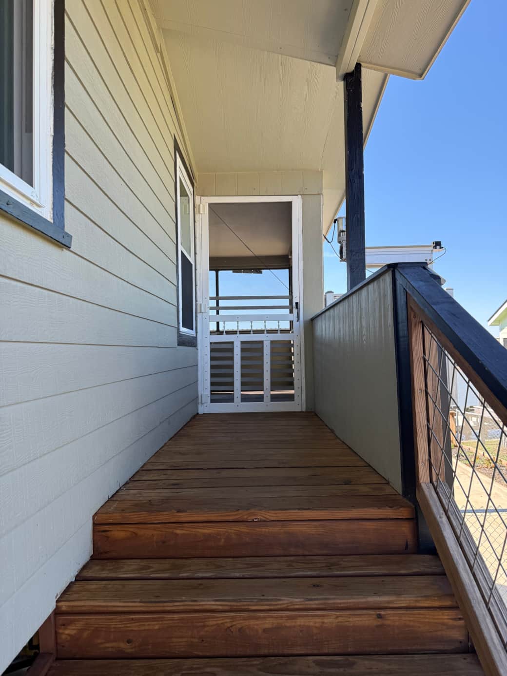 The upstairs is accessed through the screened door.