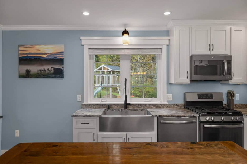 The kitchen window overlooks the backyard, allowing you to watch the kids playing while preparing meals in the kitchen.