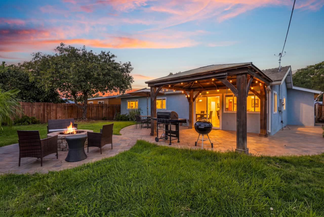 Covered Backyard Seating & In The Evening