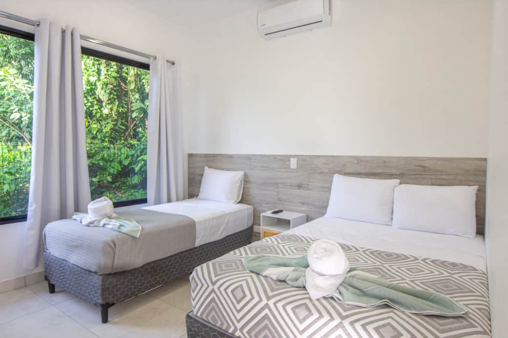 Villas-somnara-bright-bedroom-double-single-bed-air-conditioning