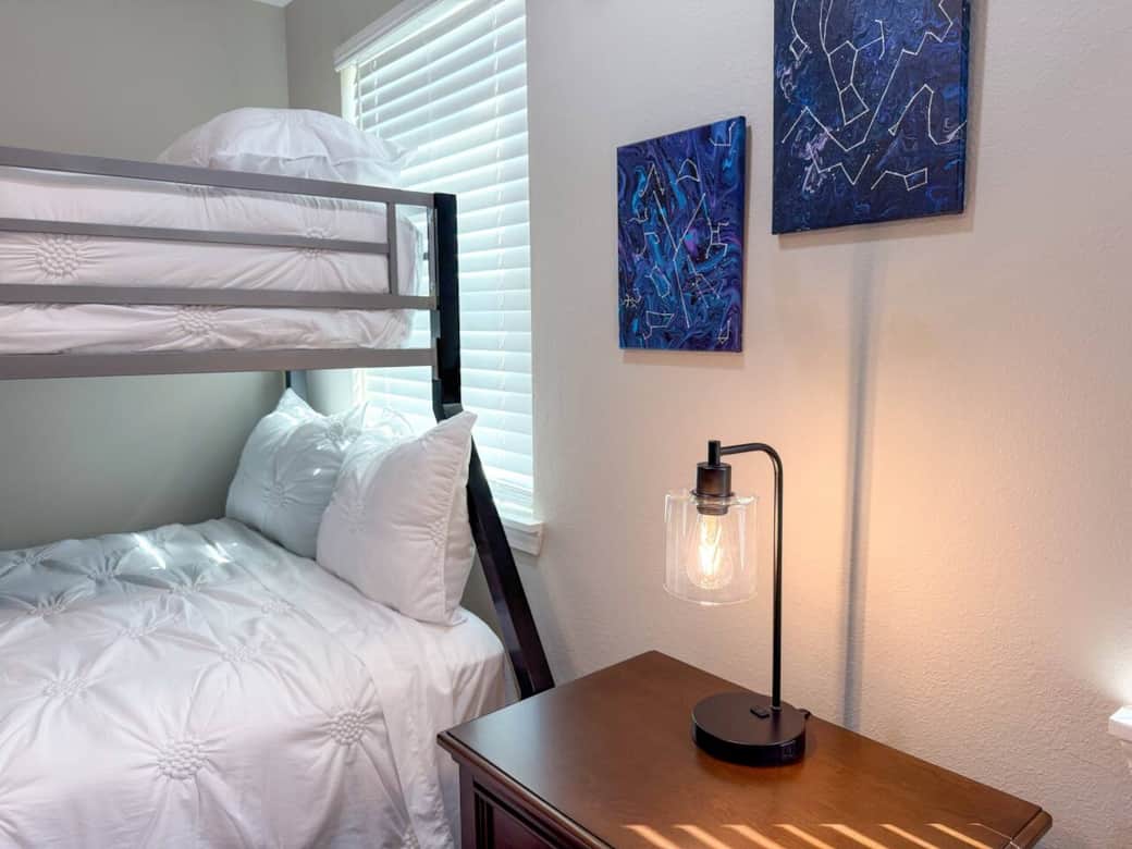 Lia Room - This spacious bedroom features a bunk bed, full-size down and twin-size up, and a smart TV.