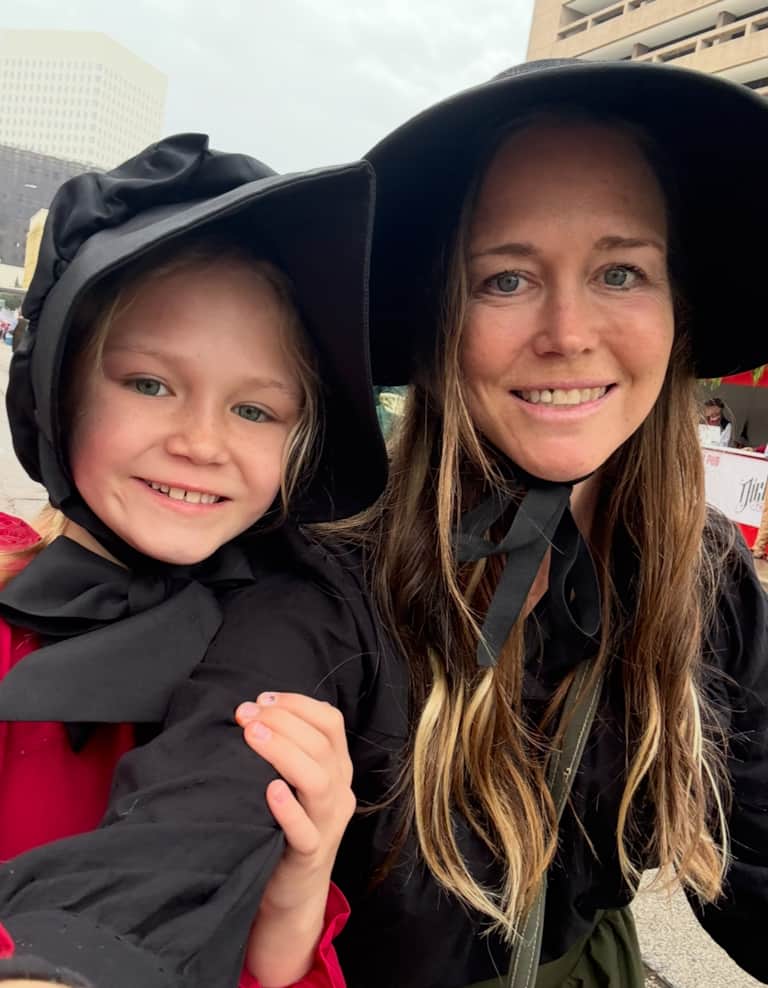 Mother and daughter in Victorian-inspired outfits enjoying Dickens on the Strand in Galveston