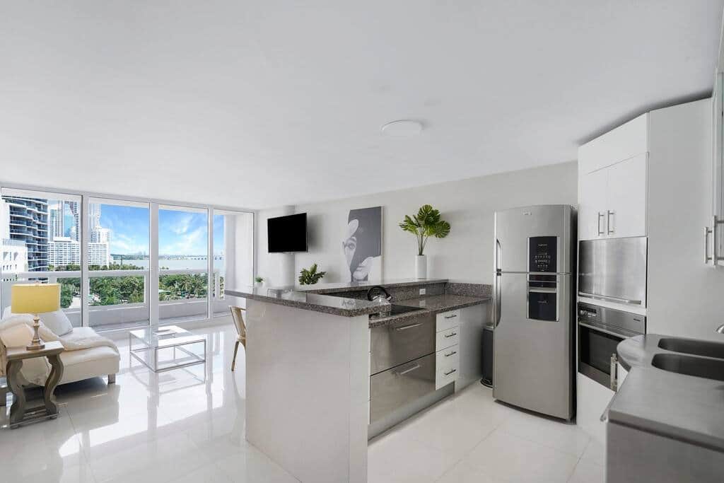 Living/dining area, Tv, balcony access, fully equipped kitchen, views of Biscayne Bay