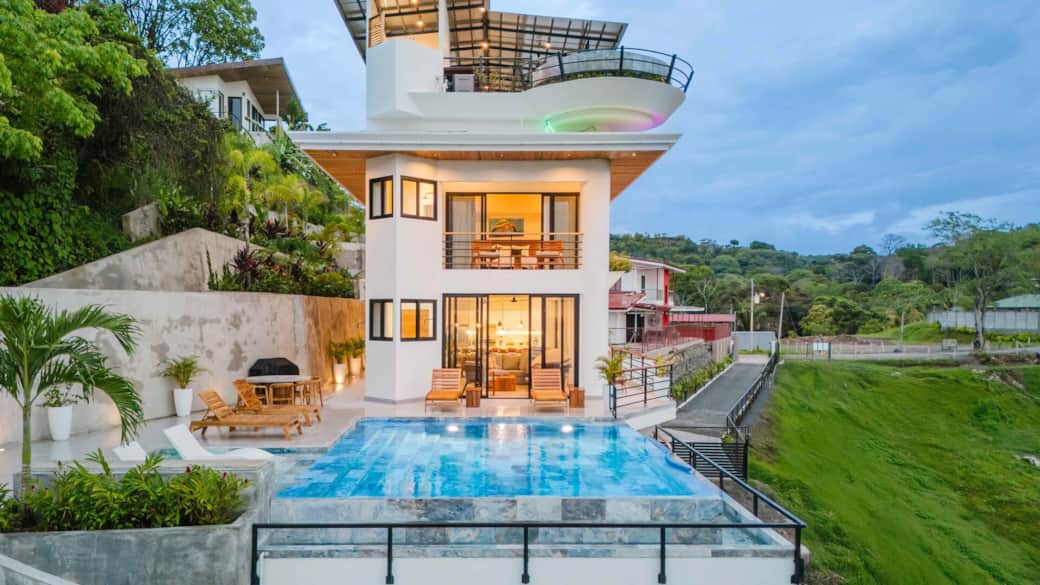 Modern hillside villa with ocean-view terraces and luxury design.