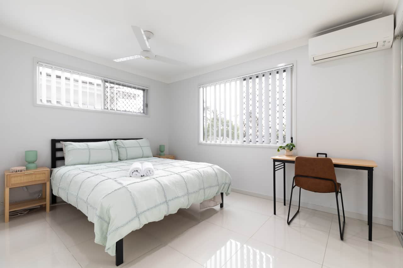 Bedroom: Peaceful bedroom with cozy design and ample storage 