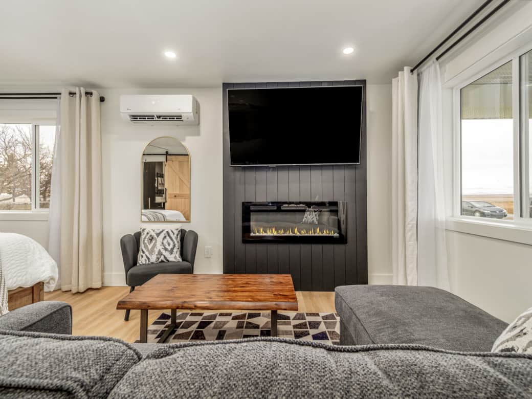 Big screen TV and fireplace