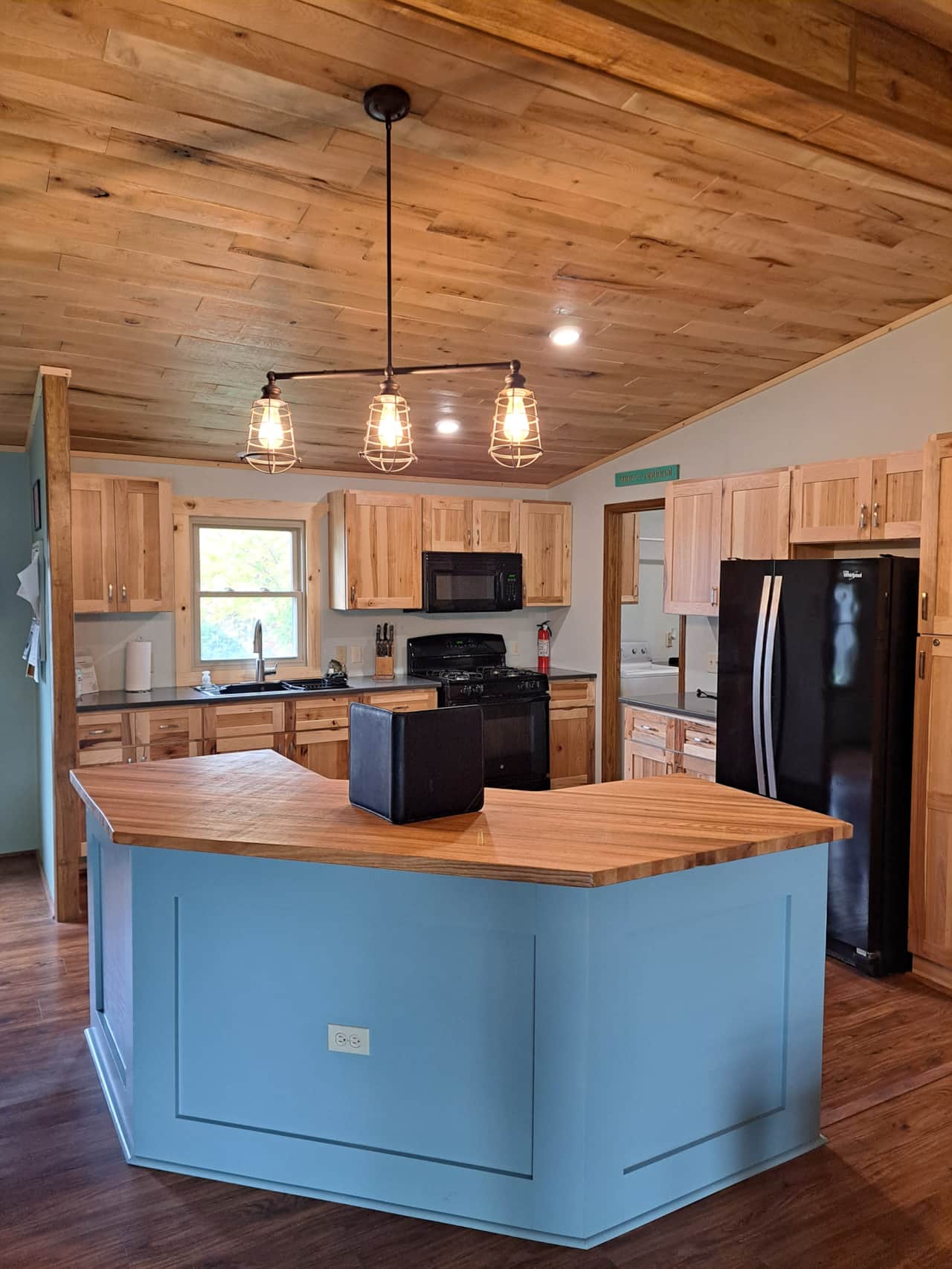 Full kitchen - sink, stove, oven, microwave, refrigerator, & freezer 