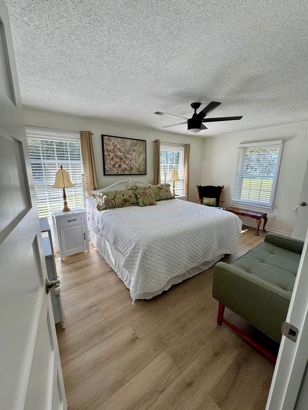 Master bedroom with king bed & attached bathroom with shower.  This room is great for a family with a baby as it has a comfy rocking chair. There is space by the rocking chair to set up our pack-n-play that’s in the Master Bedroom closet by the door.