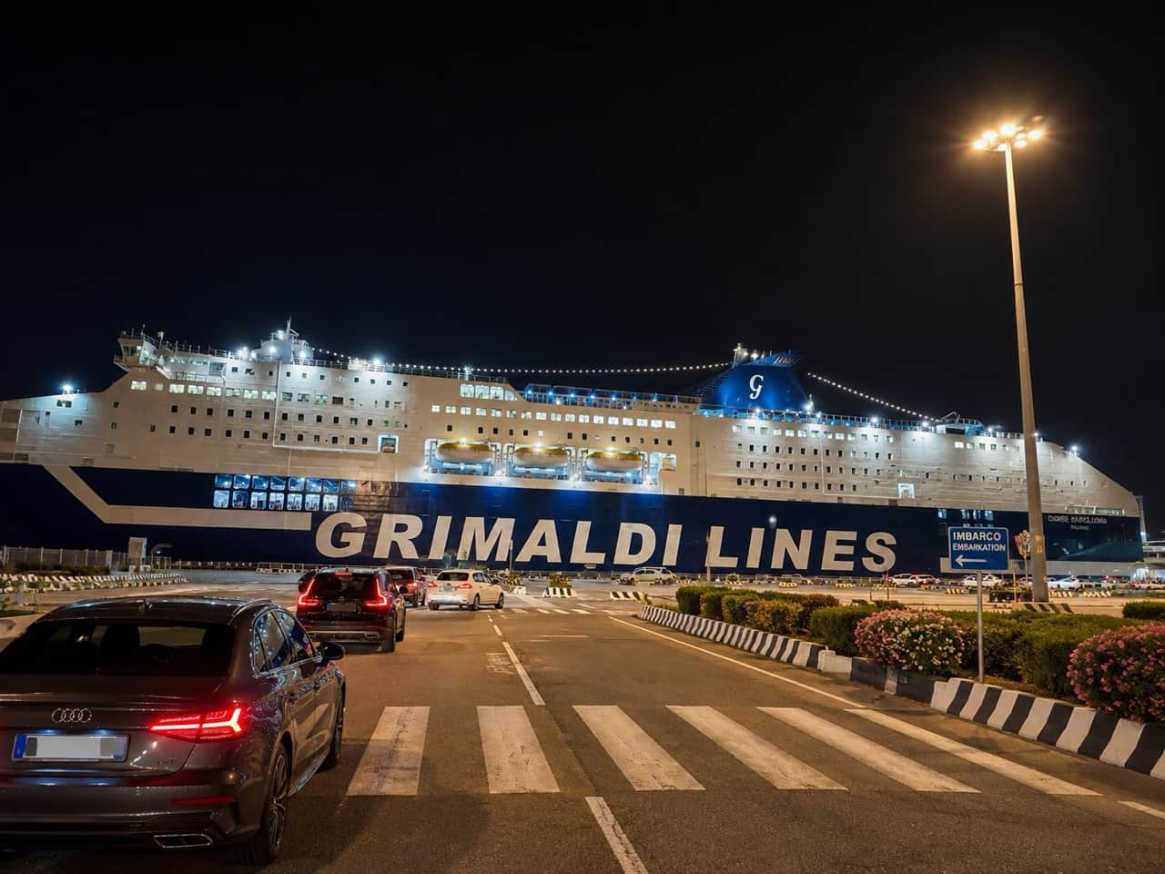 Grimaldi Lines ferry arriving at Olbia ferry terminal Isola Bianca at night, Sardinia — RENTAL12 partner