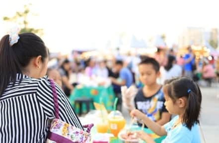 Crowds enjoying food and music on Market Street in Galveston