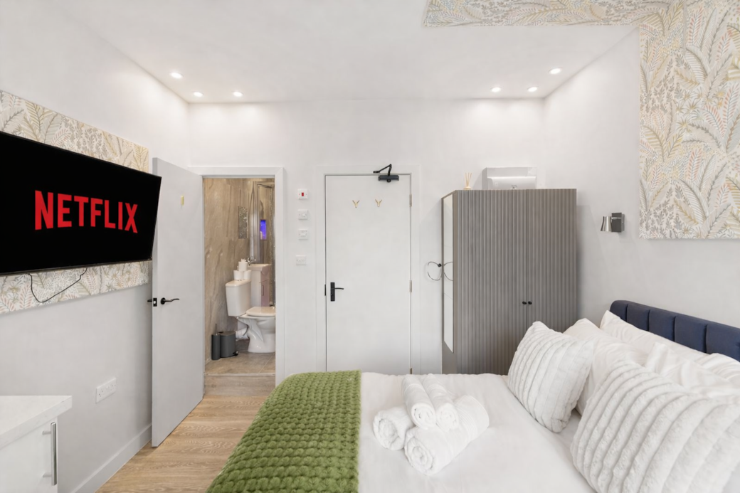 A beautifully designed bedroom featuring a plush double bed with premium linens, Smart TV A beautifully designed bedroom featuring a plush double bed with premium linens, Smart TV