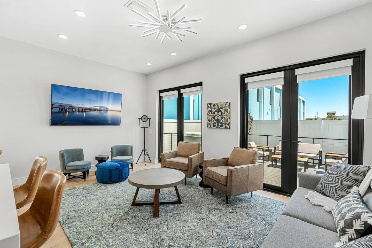 Relax in the spacious living area with comfortable seating and bright, inviting decor.
