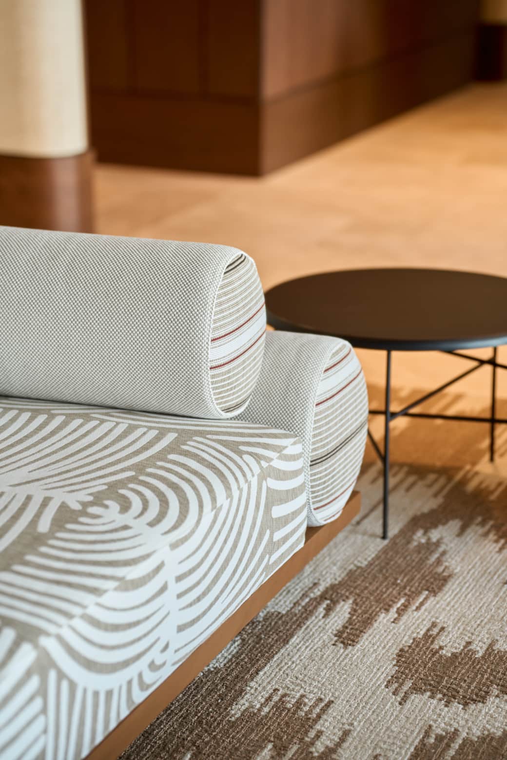 Designer seating with refined textures and warm finishes.
