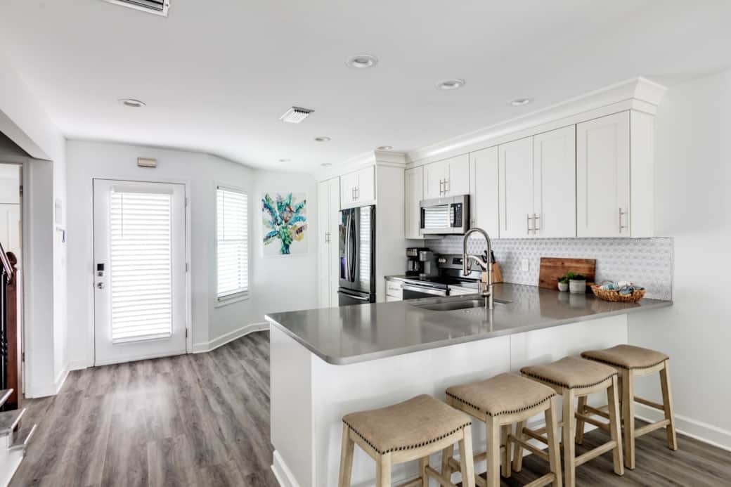 The kitchen overlooks the dining area and living room, great for entertaining! The kitchen overlooks the dining area and living room, great for entertaining!
