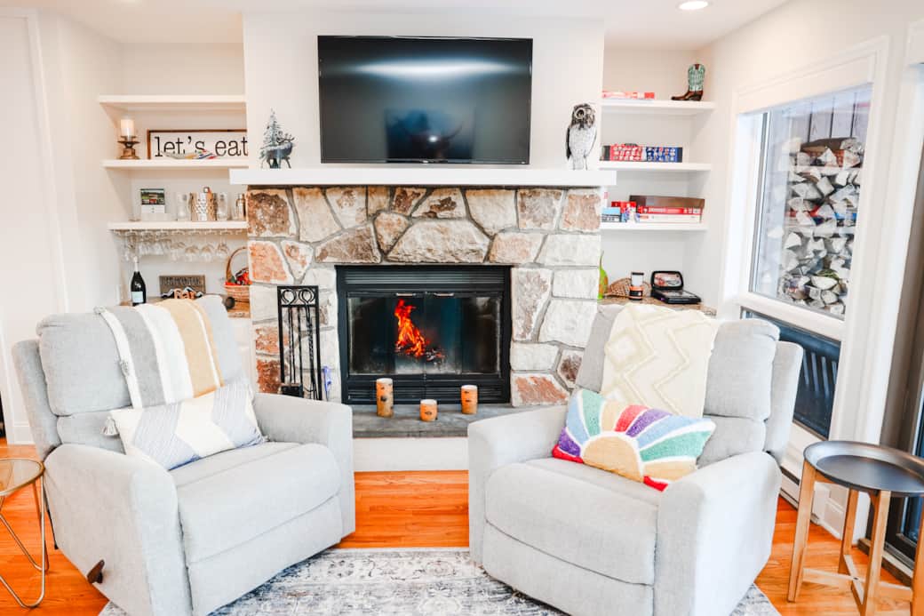 The charming fireplace creates an intimate setting.