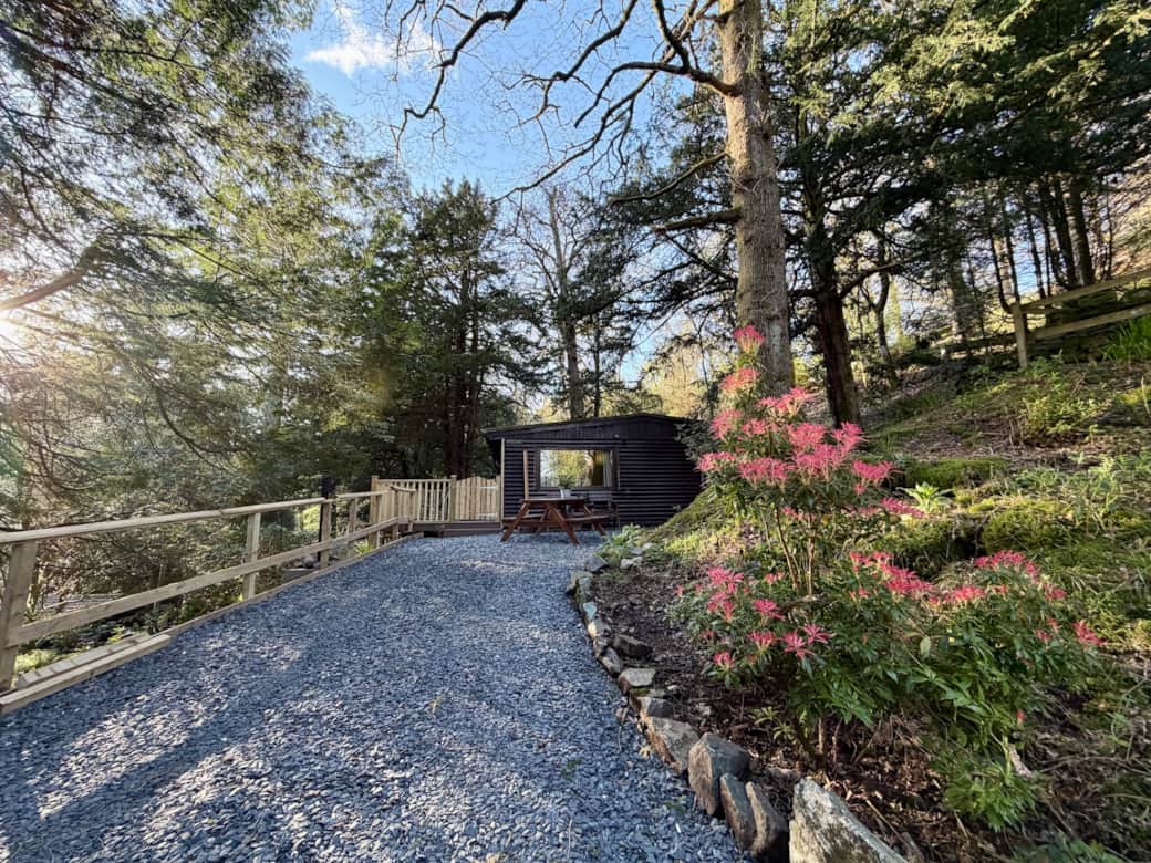 Large drive with various outdoor seating areas and private EV charger