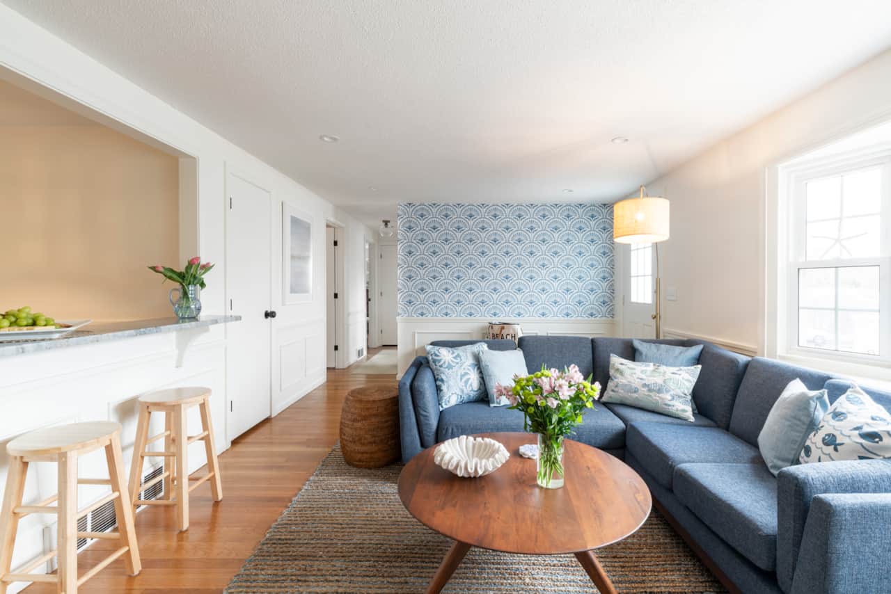 Living space with opening into kitchen with breakfast bar