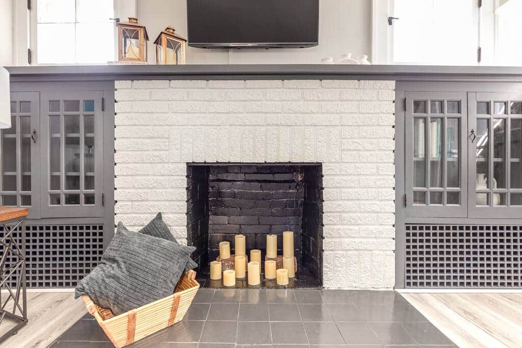 Original fireplace and built-in cabinets. Freshly painted and restored.