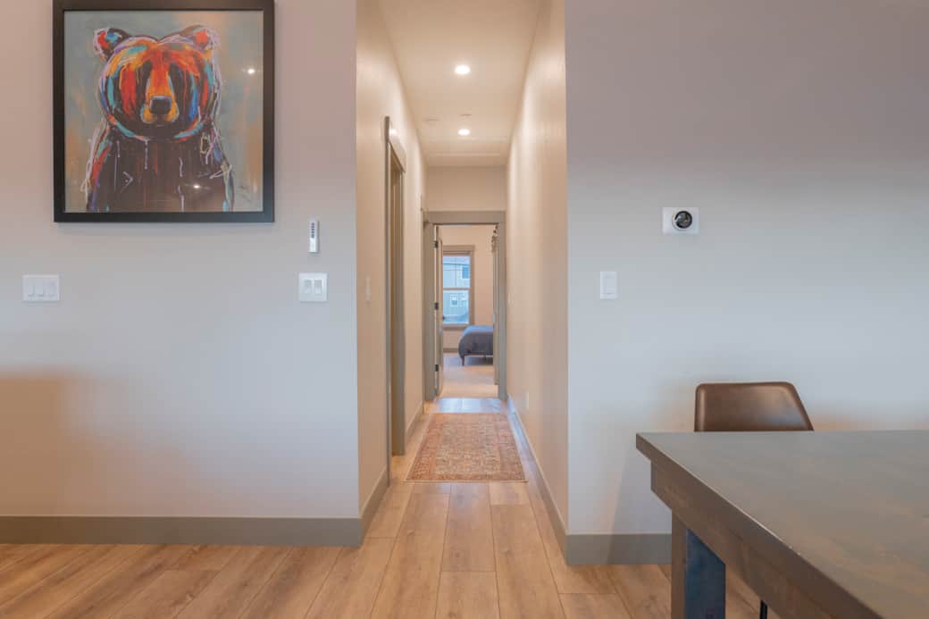 Upstairs hallway leading to both en-suite bedrooms and half bath.