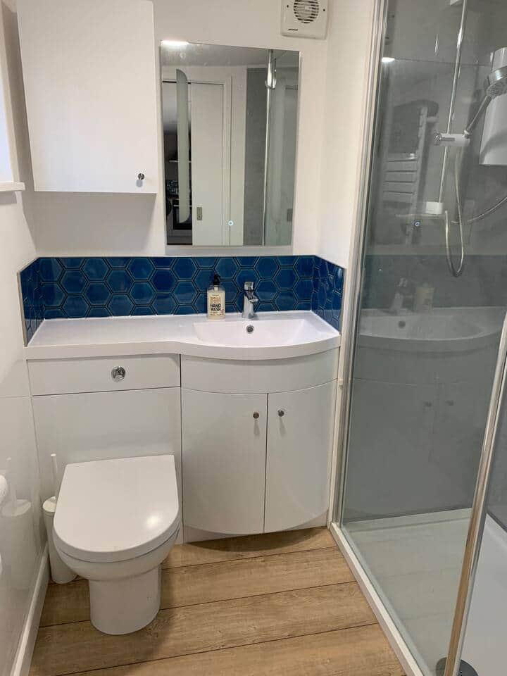 The modern bathroom has a walk in shower, heated towel rail and de-mista mirror. The modern bathroom has a walk in shower, heated towel rail and de-mista mirror.