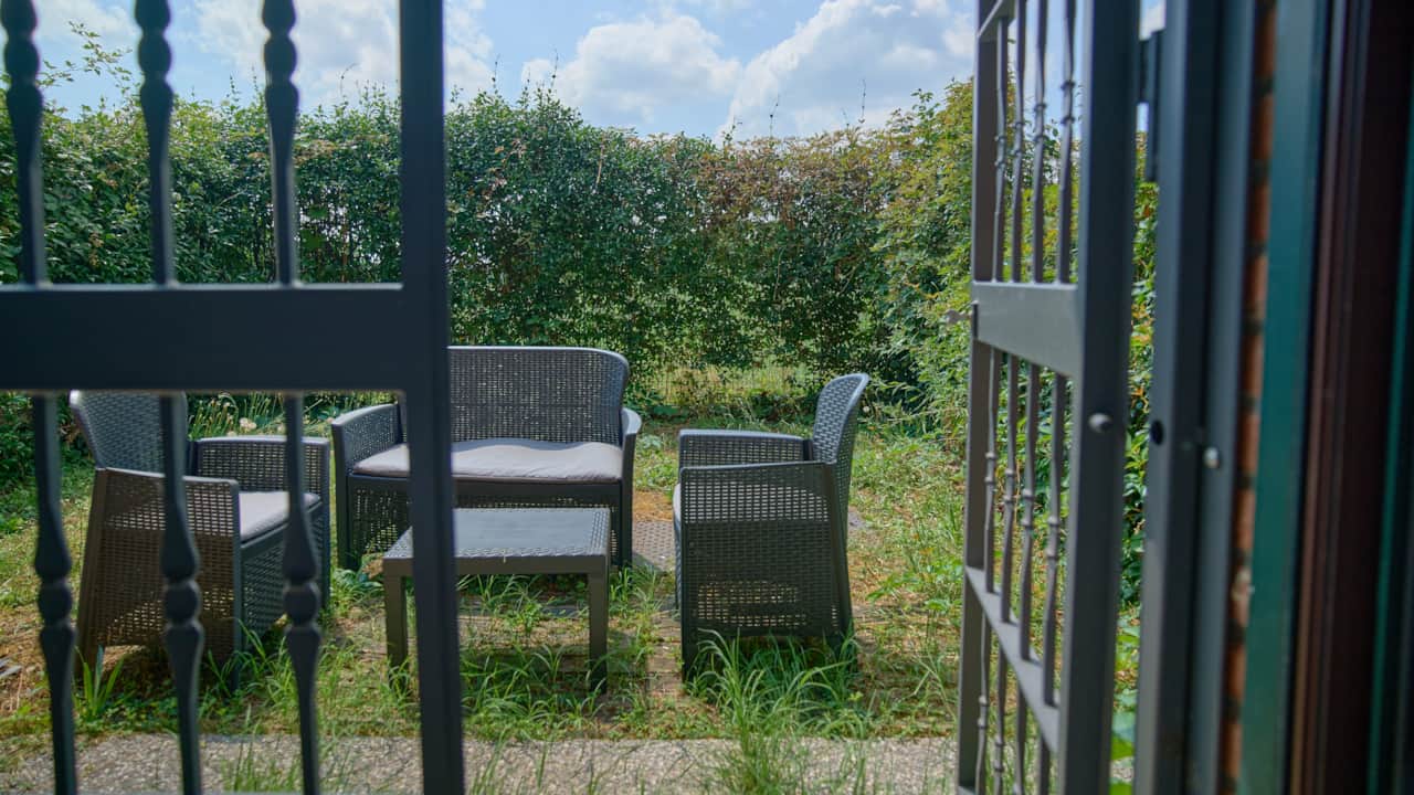 Garden with outdoor table and chairs on the lawn