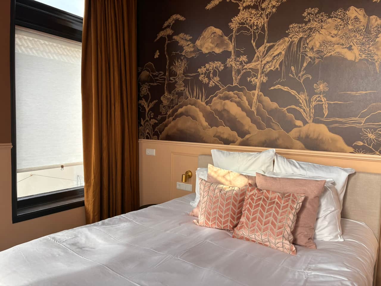 Close up of Eleonora Suite facing the window with wallpaper mural