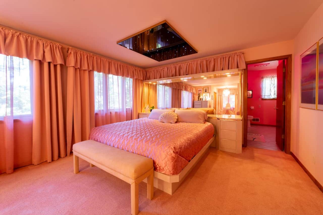 Star Crossed bedroom with starry ceiling mirror and a king-sized bed