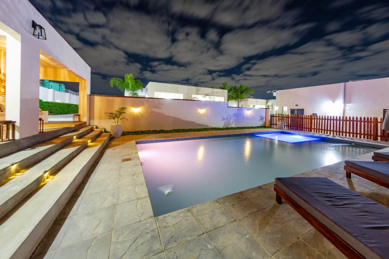 Shared swimming pool with evening lighting