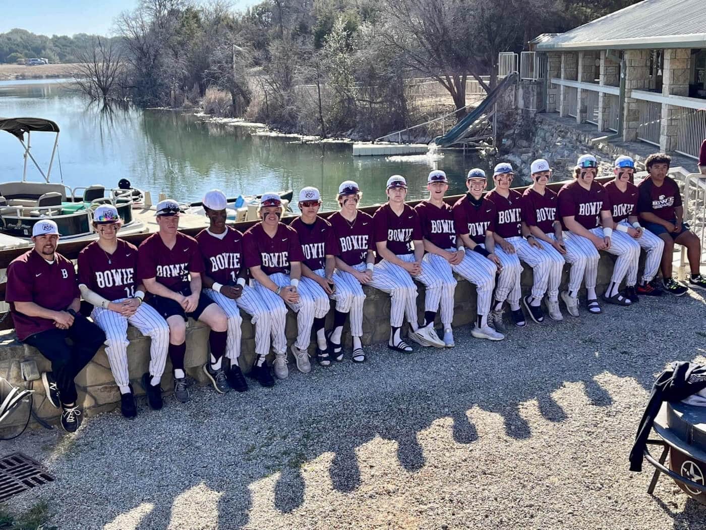 Baseball team photo at the lodge fire pit overlooking Lake Godstone