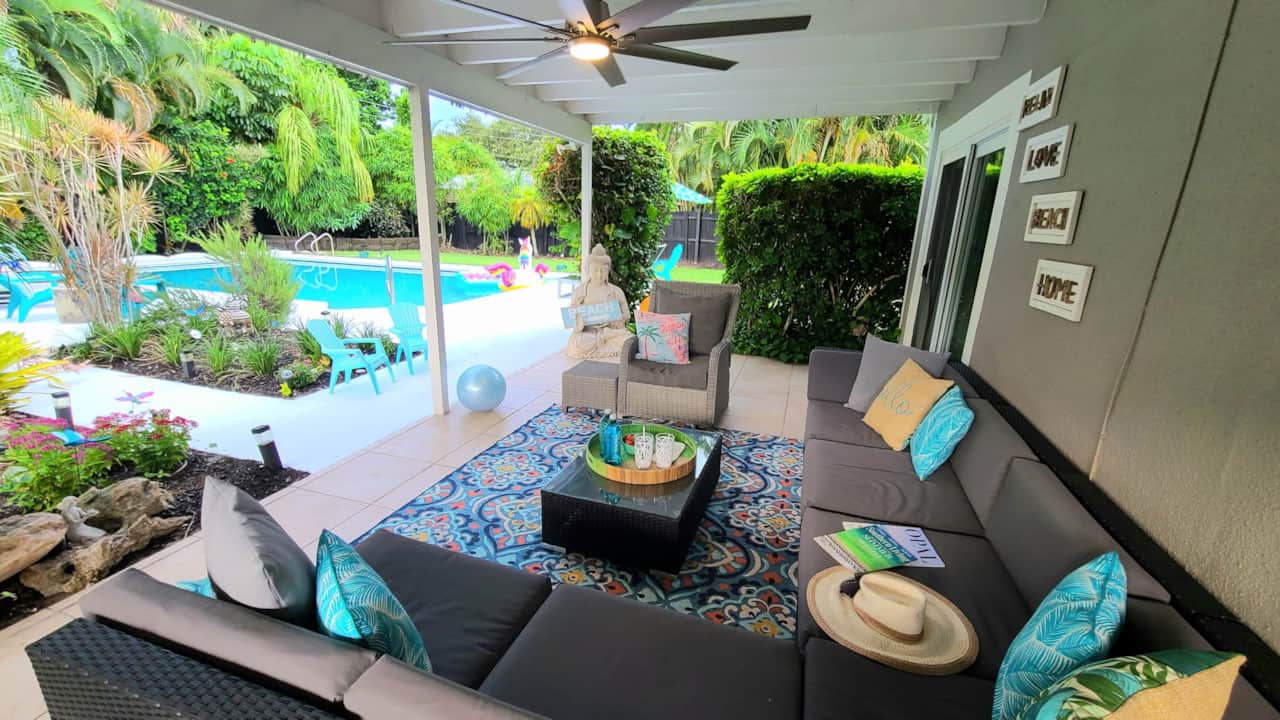 Covered Patio with Tropical Garden and Pool Views