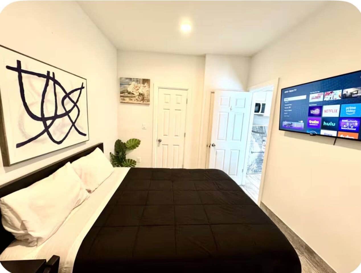 
Welcome to this beautiful room! It features a cozy queen bed, small closet, and a flat-screen TV for your entertainment. The decor is both stunning and thoughtfully curated, making it a lovely space to relax and unwind. Enjoy your stay!! 