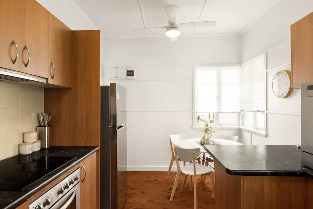 Kitchen: Sleek kitchen with ample storage, modern appliances Kitchen: Sleek kitchen with ample storage, modern appliances