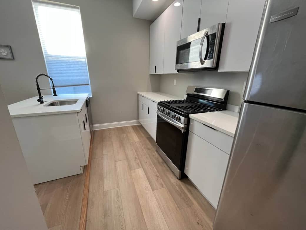 Big new kitchen with breakfast bar, dishwasher , oven/range , microwave, garbage disposal, stainless refrigerator.