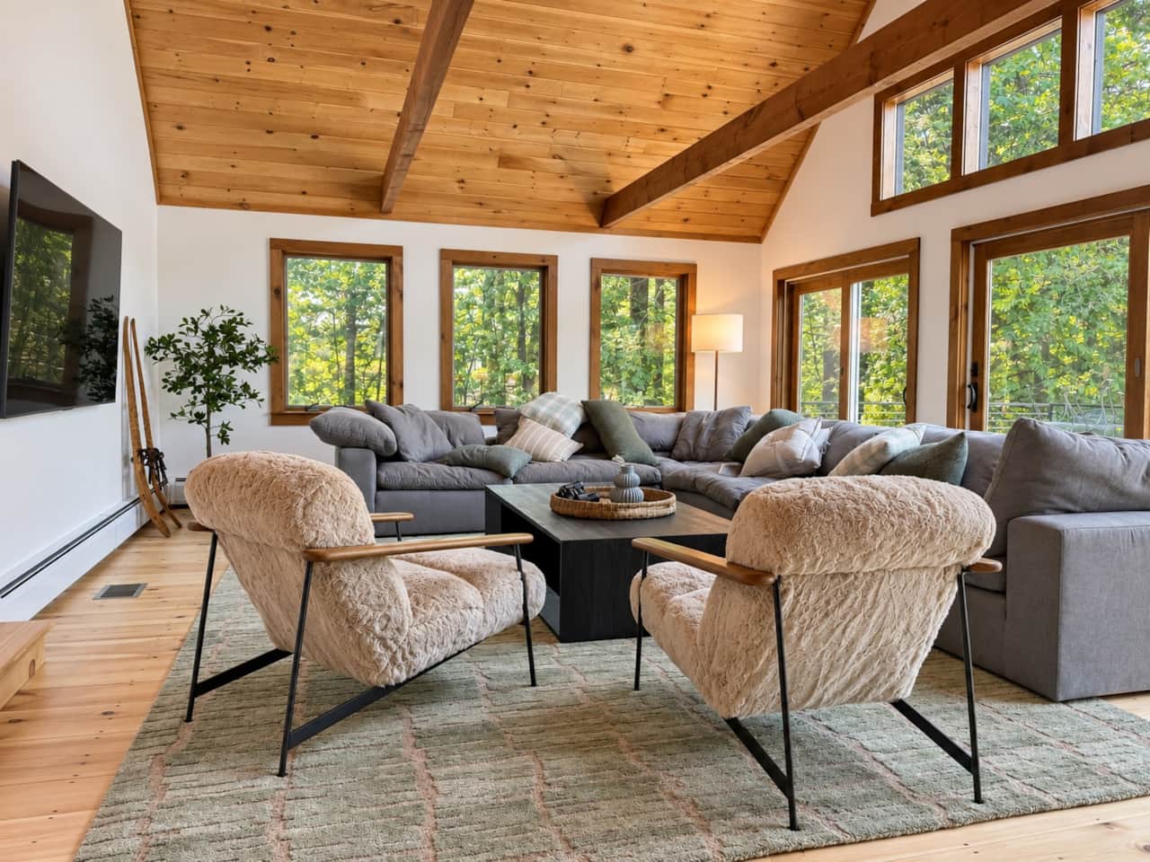 Warm modern-rustic living spaces with peaceful waterfront views