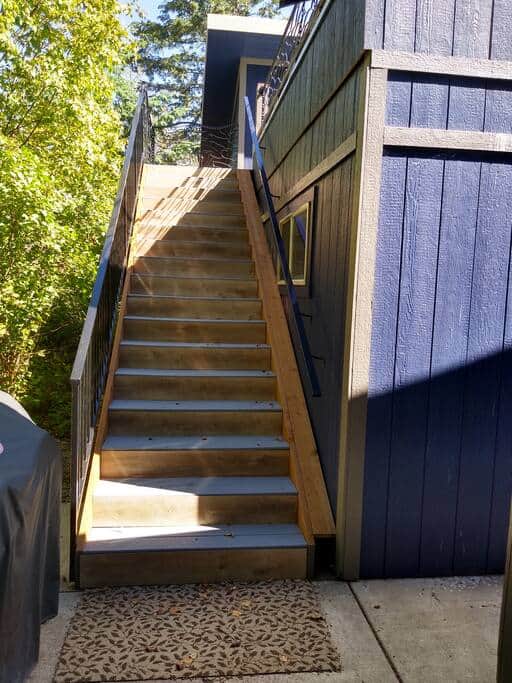 Stairs to the rooftop deck just off the back porch Stairs to the rooftop deck just off the back porch