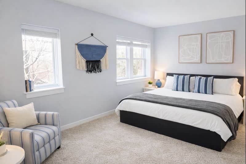 Bright and spacious bedroom with a king bed, large closet, and dual windows for beautiful natural light.