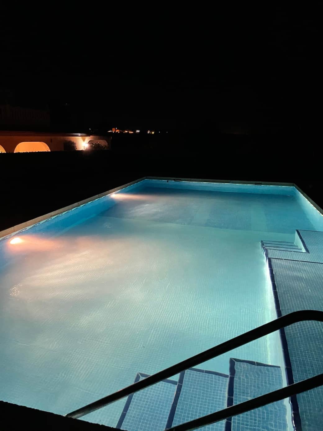 Private swimming pool by night