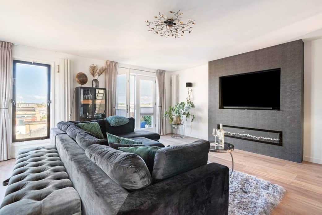 Royal living room with plenty of natural light and a large comfortable sofa
