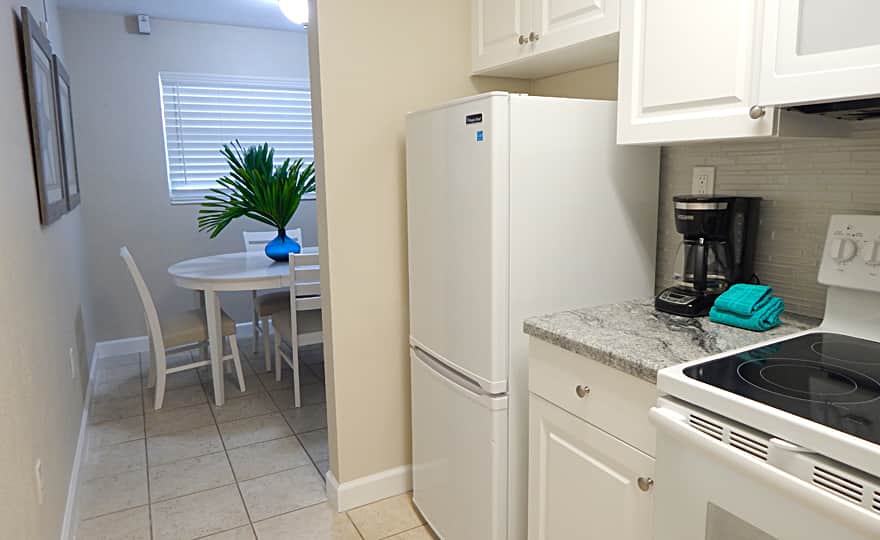 Unit #8 - Kitchen is stocked with essentials to prepare a complete meal.