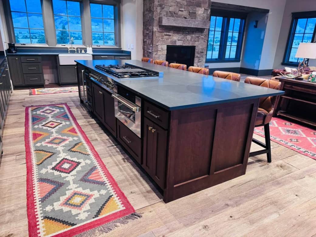 Kitchen Island with premium gas range, downdraft exhaust, wine cooler, and microwave drawer