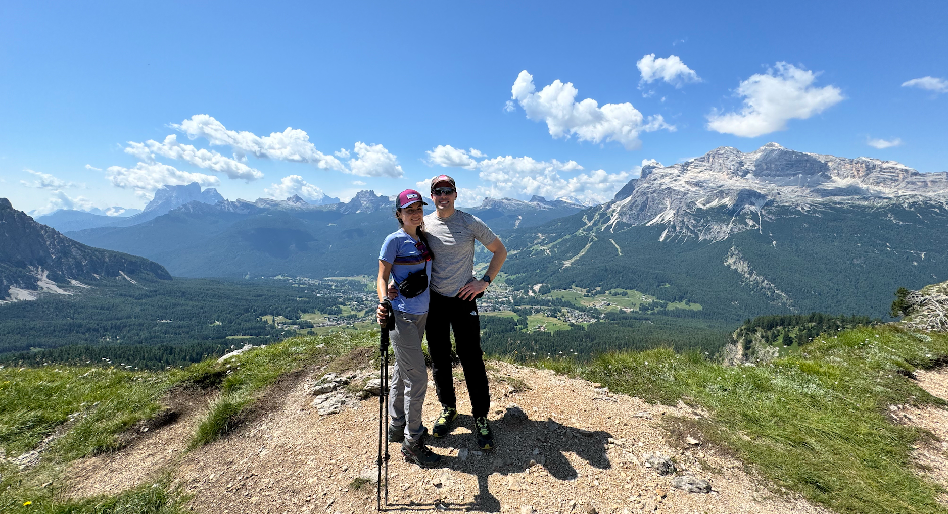 Laura and Andrea together in the mountains, with the Dolomites behind them