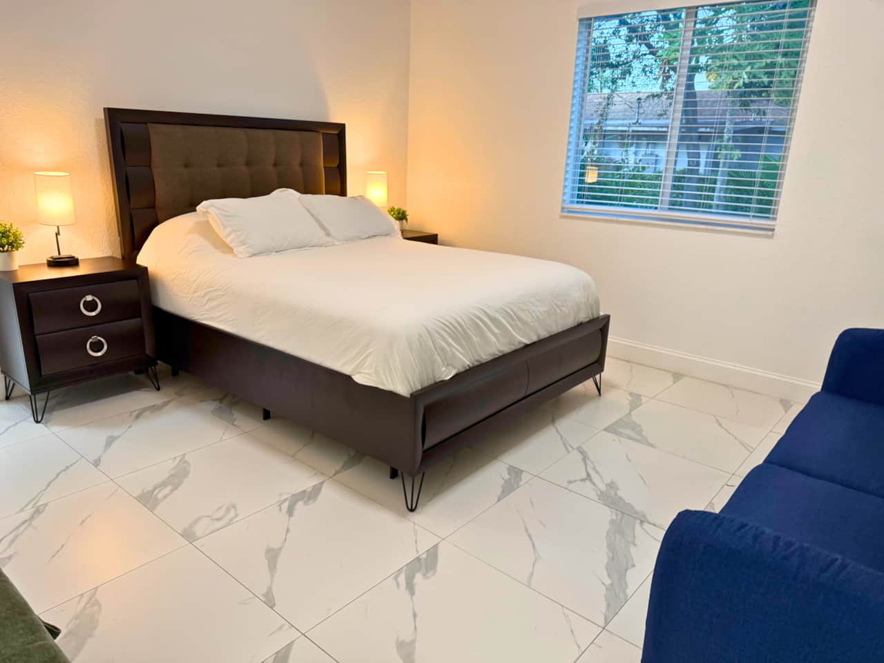 Primary: Comfortable primary bedroom with queen bed, Smart TV, workspace and private ensuite.