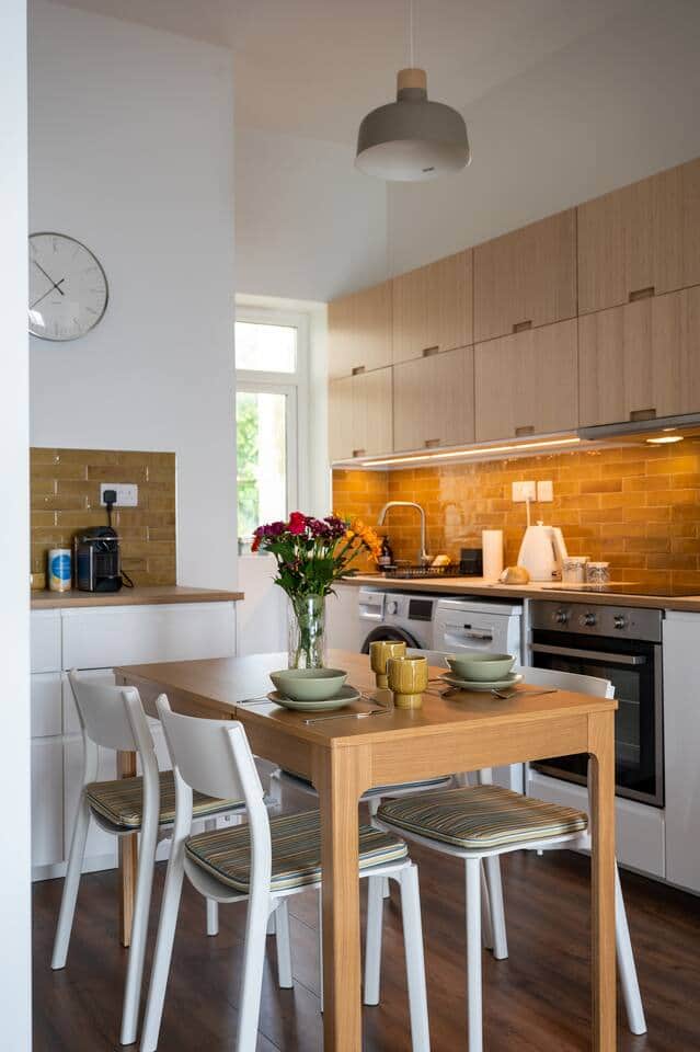 A full kitchen with  oven, microwave,dishwasher ,washing machine ,toaster , kettle and a nespresso coffee machine .