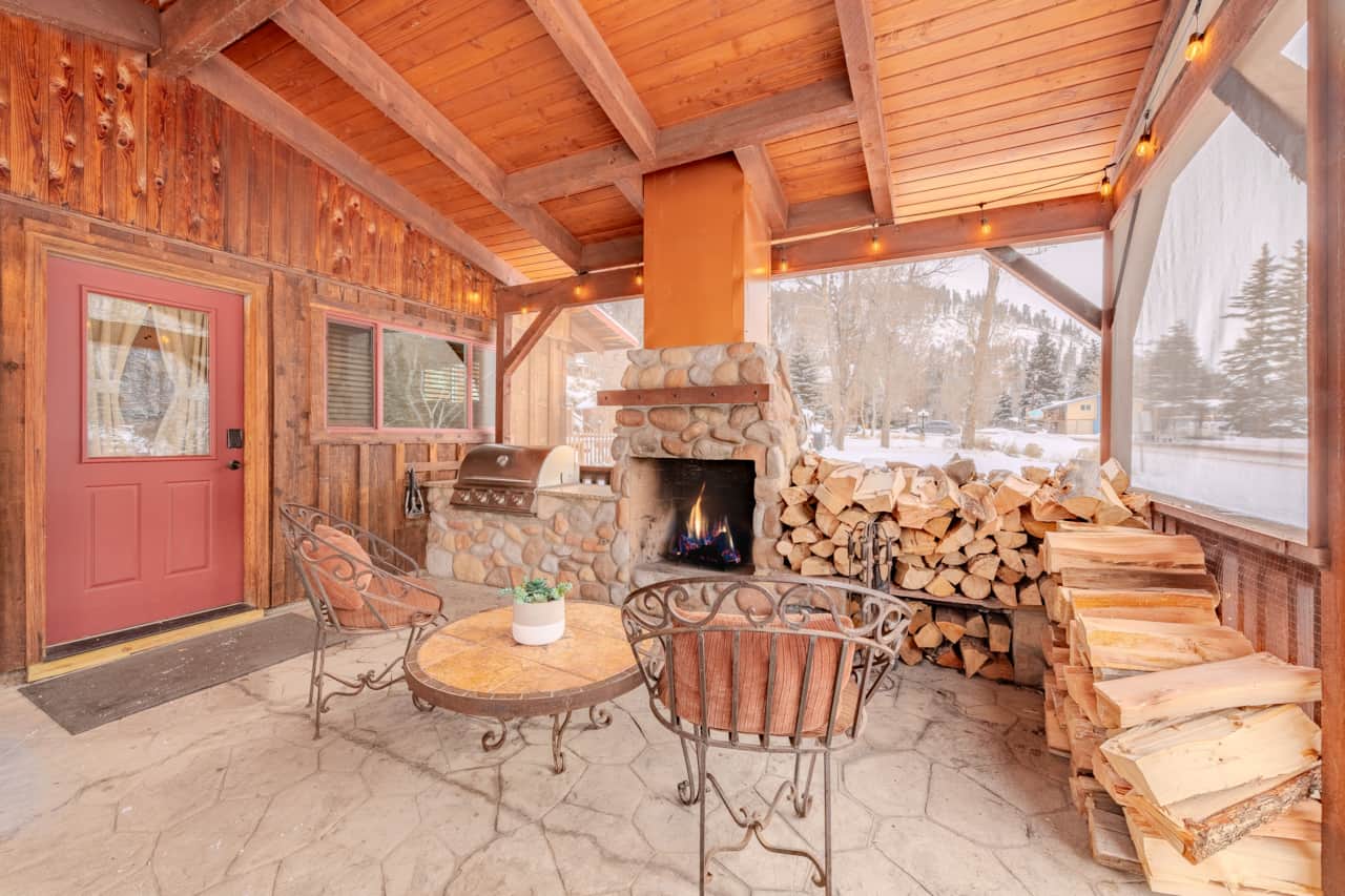 Enclosed front patio with gas starting -wood burning fireplace.